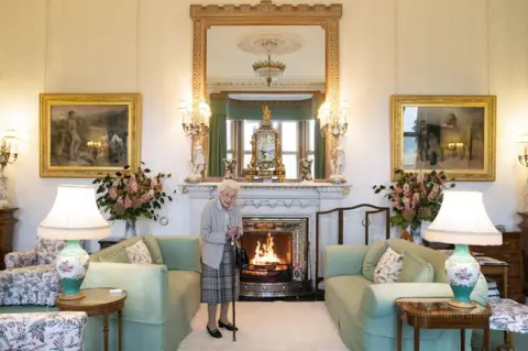 PA Media Queen Elizabeth II waits in the Drawing Room before receiving Liz Truss for an audience at Balmoral, Scotland