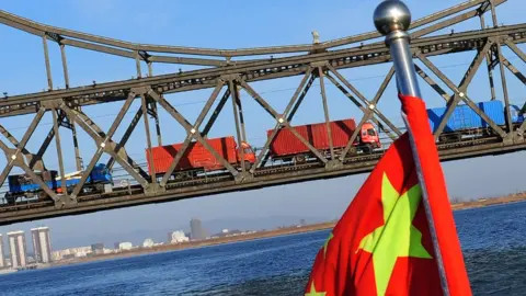 AFP Bridge with cargo trucks