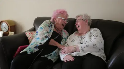 Two women laughing