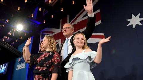 Getty Images Scott Morrison and his children wave to supporters at his victory party