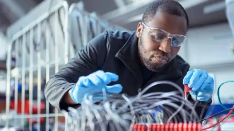 Getty Images A engineer on a factory production line