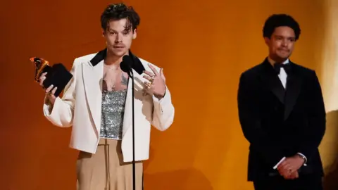 Reuters Harry Styles accepts the Album Of The Year award for "Harry"s House" during the 65th Annual Grammy Awards in Los Angeles, California, U.S.