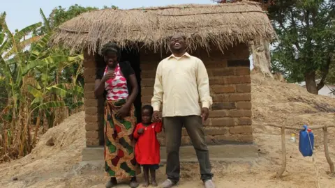 Toilet Twinning Villagers standing in front of a newly built lavatory