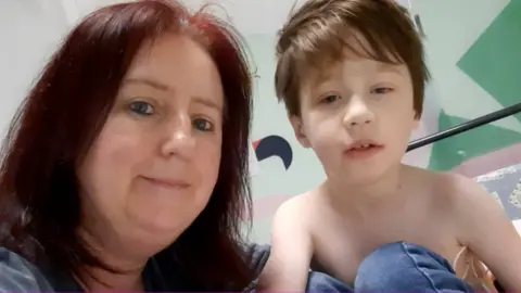 Family handout Helen Clark with her son Bailey