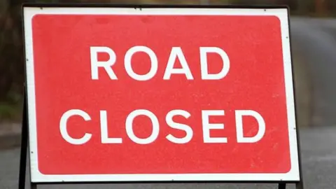 A road closed sign