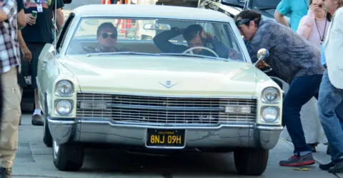 Getty Images Leonardo DiCaprio and Brad Pitt filming with director Quentin Tarantino