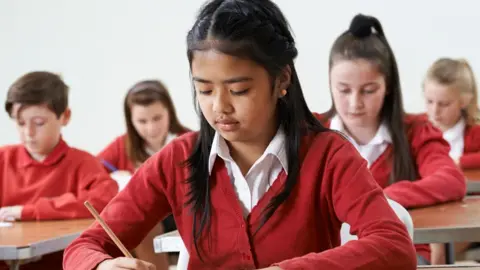 Getty Images Children taking a school test