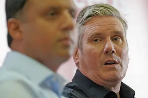 PA Media Sarwar and Starmer