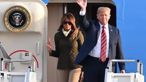 Getty Images Donald and Melania Trump arriving at Prestwick