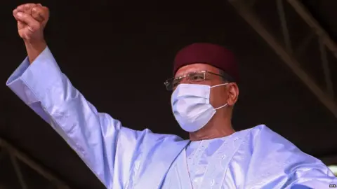 EPA Mohamed Bazoum celebrates his election victory.