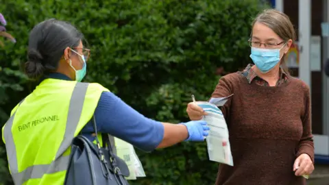 PA Media Volunteers hand out testing kits