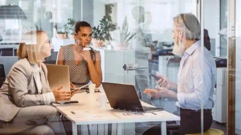 Getty Images People in an office