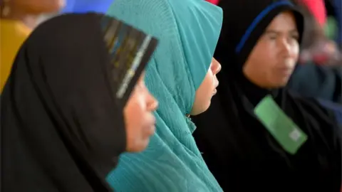 Getty Images Cambodian Muslim women attend the tribunal in Phnom Penh (16 Nov 2018)