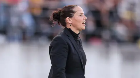 Rhian Wilkinson on the touchline 