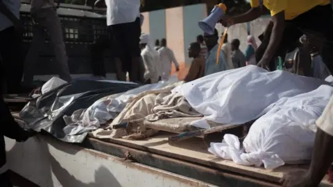 AFP Dead bodies displayed
