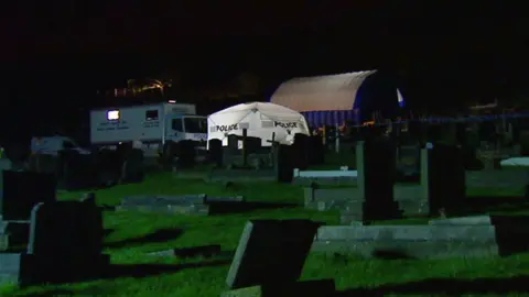 A police tent over Kappen's grave