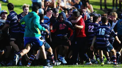 Getty Images Large group of rugby players celebrating