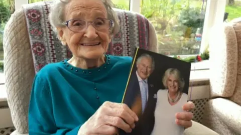 Ada Thompson with her card from the King