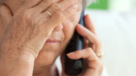 Getty Images stock image of an older person on the phone