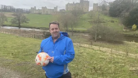 Brian Hunt Stephen Temple standing on the edge of the Pastures where the game is played