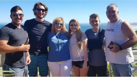 Deaghlan with his family in South Africa