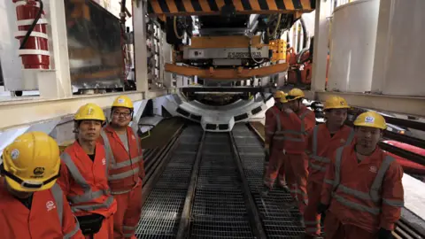 Getty Images Chinese workers building the Tel Aviv underground