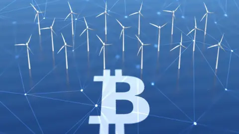 Getty Images Bitcoin sign with wind turbines