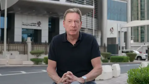 The BBC's Frank Gardner wearing a black polo shirt