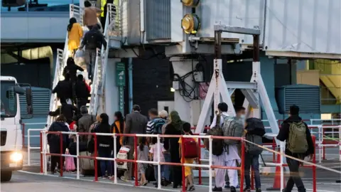 PA Media Afghan families