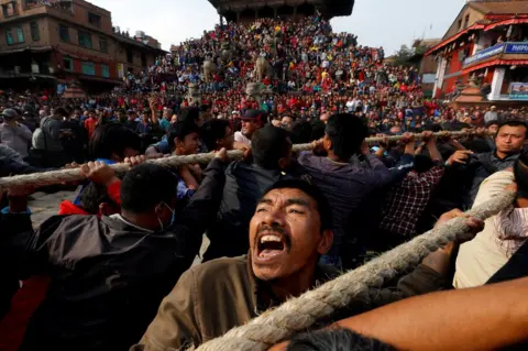 Navesh Chitrakar/ Reuters Devotees pull the chariot of the god Bhairab during the Biska Festival.