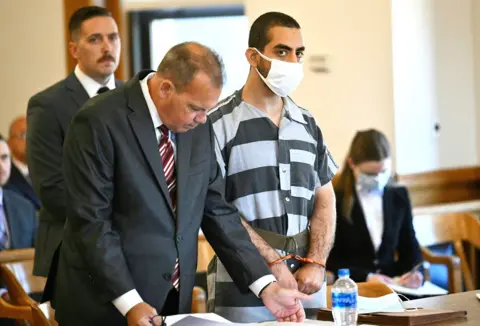 Getty Images Hadi Matar pictured in court with mask