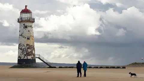 Getty Images Point of Ayr Lighthouse in Talacre, Flintshire, was discontinued in 1883, and is the oldest lighthouse in Wales