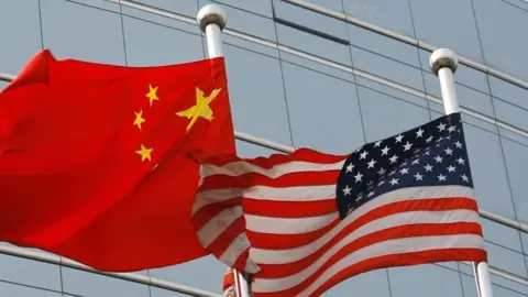 Getty Images/AFP Flags of China (left) and the US. File photo