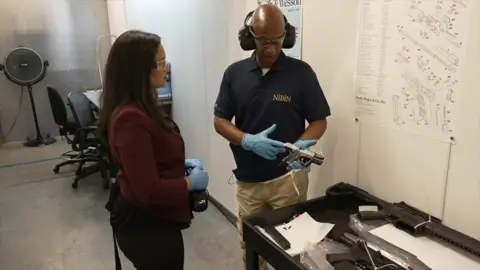 Nada Tawfik and gun expert