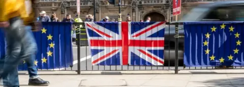 Getty Images Flags outside parliament