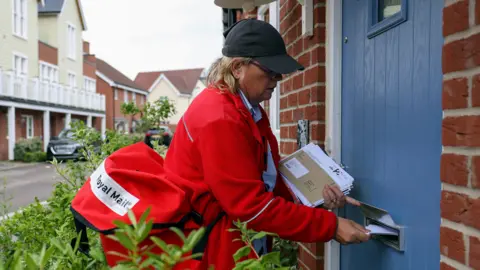 Getty Images Postal worker