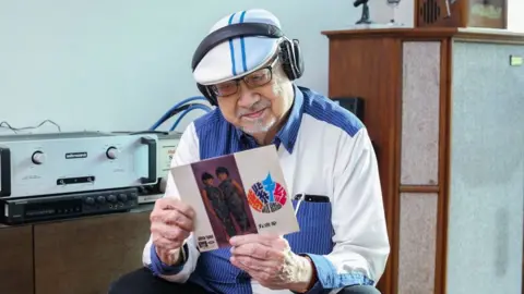 South China Morning Post Radio host Ray Cordeiro aka "Uncle Ray" pictured at his home in Kowloon Tong (11 December 2017)