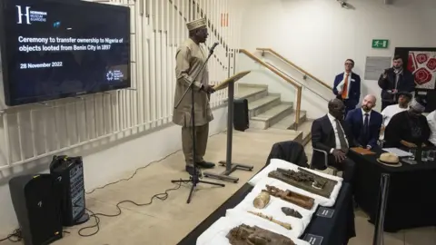 PA Media Prof Abba Tijan addresses the signing ceremony