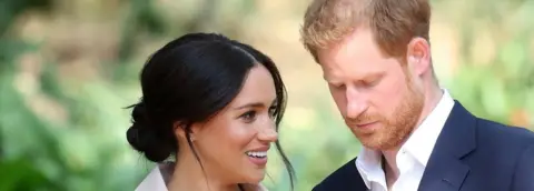 Getty Images Prince Harry and Meghan in South Africa