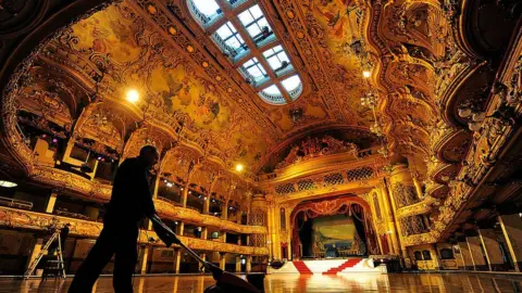 Getty Images The interior with a man cleaning