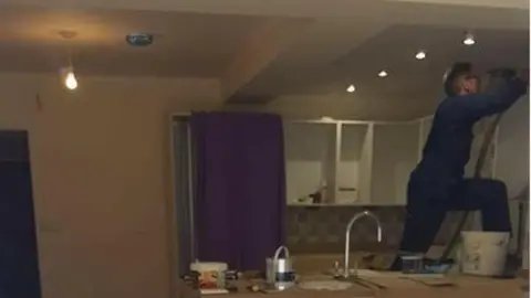 KEITH LAWSON A volunteer working to finish the house