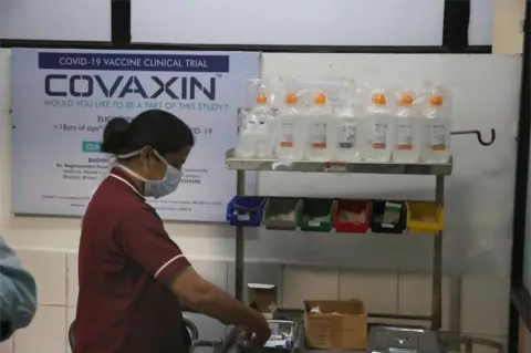 EPA A doctor prepares to inoculate volunteers with India's first Covid-19 vaccine, locally developed by Bharat Biotech in collaboration with the Indian Council of Medical Research (ICMR), during the Phase 3 trial at the People's Medical College in Bhopal, India, 07 December 2020. A