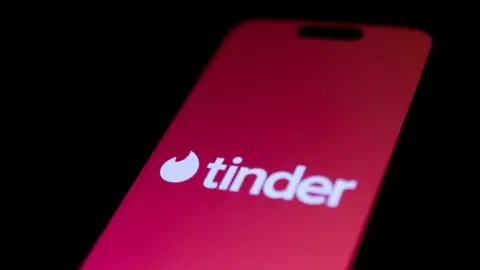 NurPhoto/Getty Images Phone screen showing Tinder