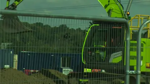 John Fairhall/BBC A digger at junction 28 of the M25 near Brentwood