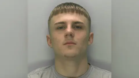 Gloucestershire Constabulary Police shot of jailed man Elliott Fitts-Hawkins with blurred lines around the side of image