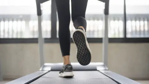 Getty Images Women legs on treadmill at gym (stock photo)