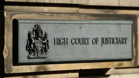 Reuters High Court sign