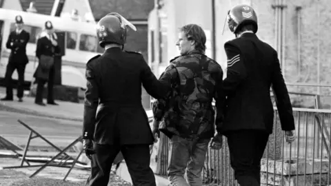 PA Media Police arrest a man during clashes at Kiveton Park Colliery