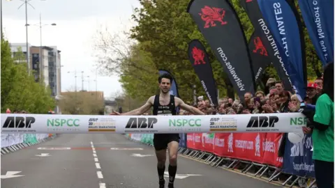 ABP Newport Marathon James Carpenter, of the Neath Harriers, was the first man to cross the finish line