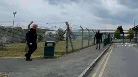 BBC Workers clocking on at Toyoda Gosei's Swansea plant